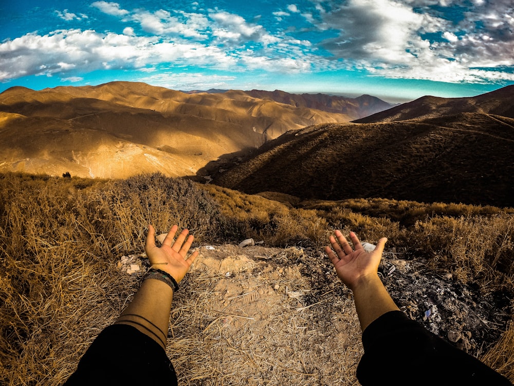 a person standing on top of a dirt road