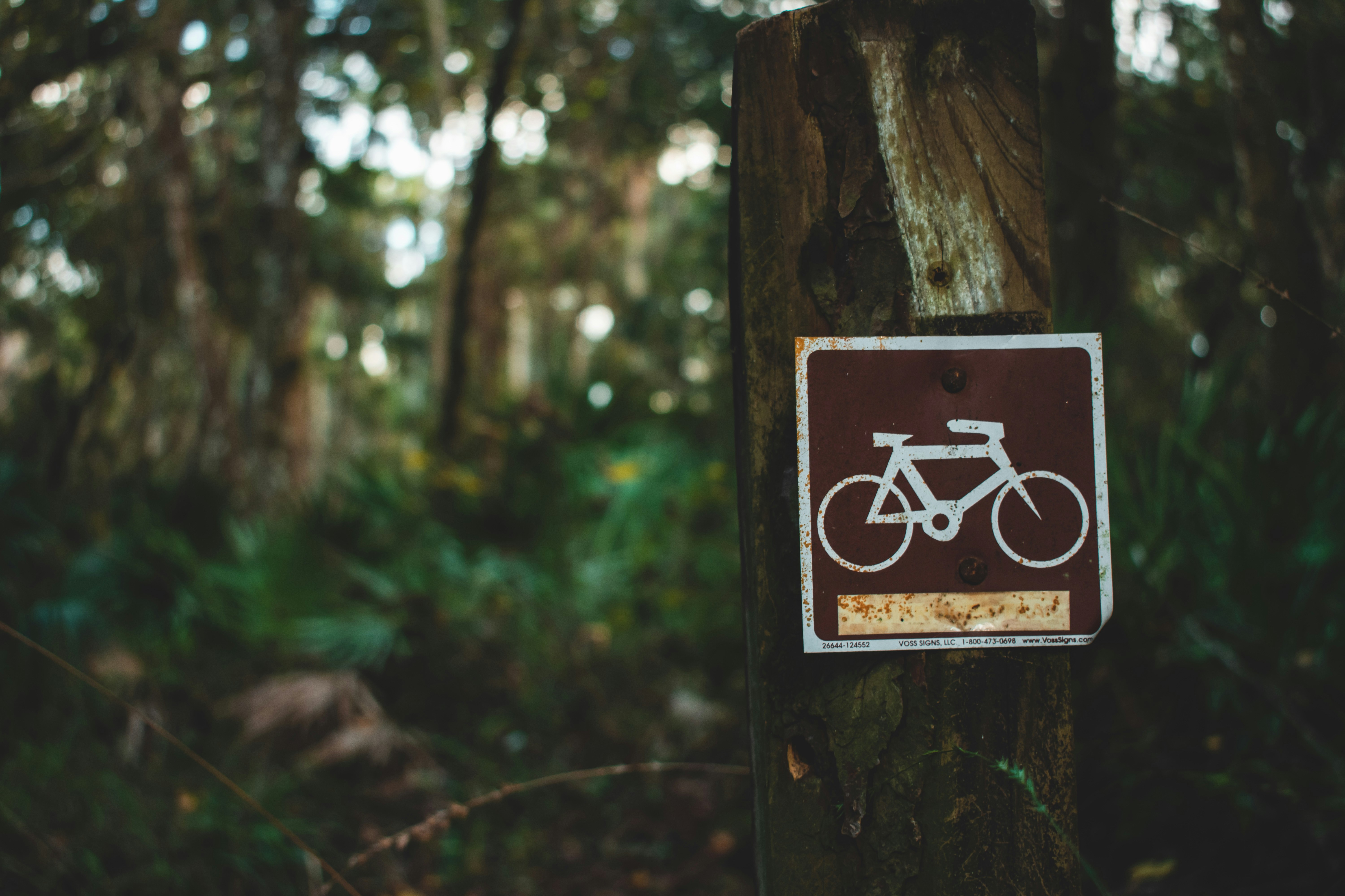 brown and white bicycle signage