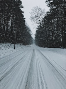 snowy road during daytime