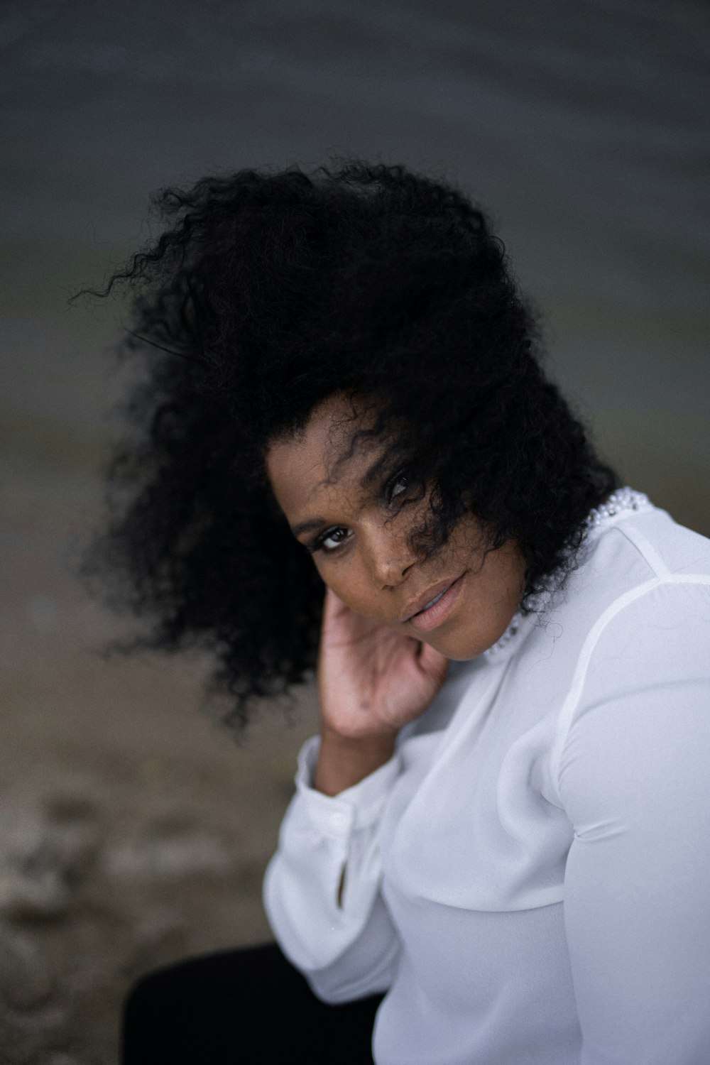 woman wearing white long-sleeved shirt