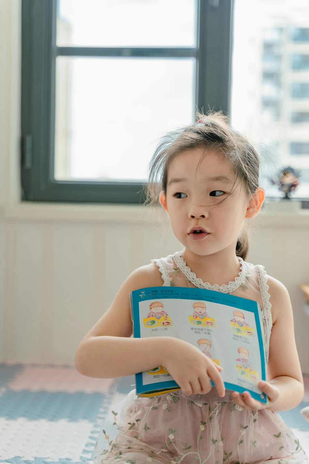 girl holding book