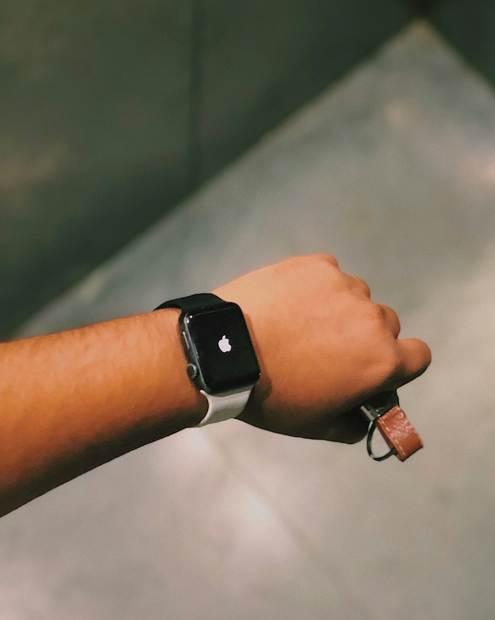 person showing black Apple Watch