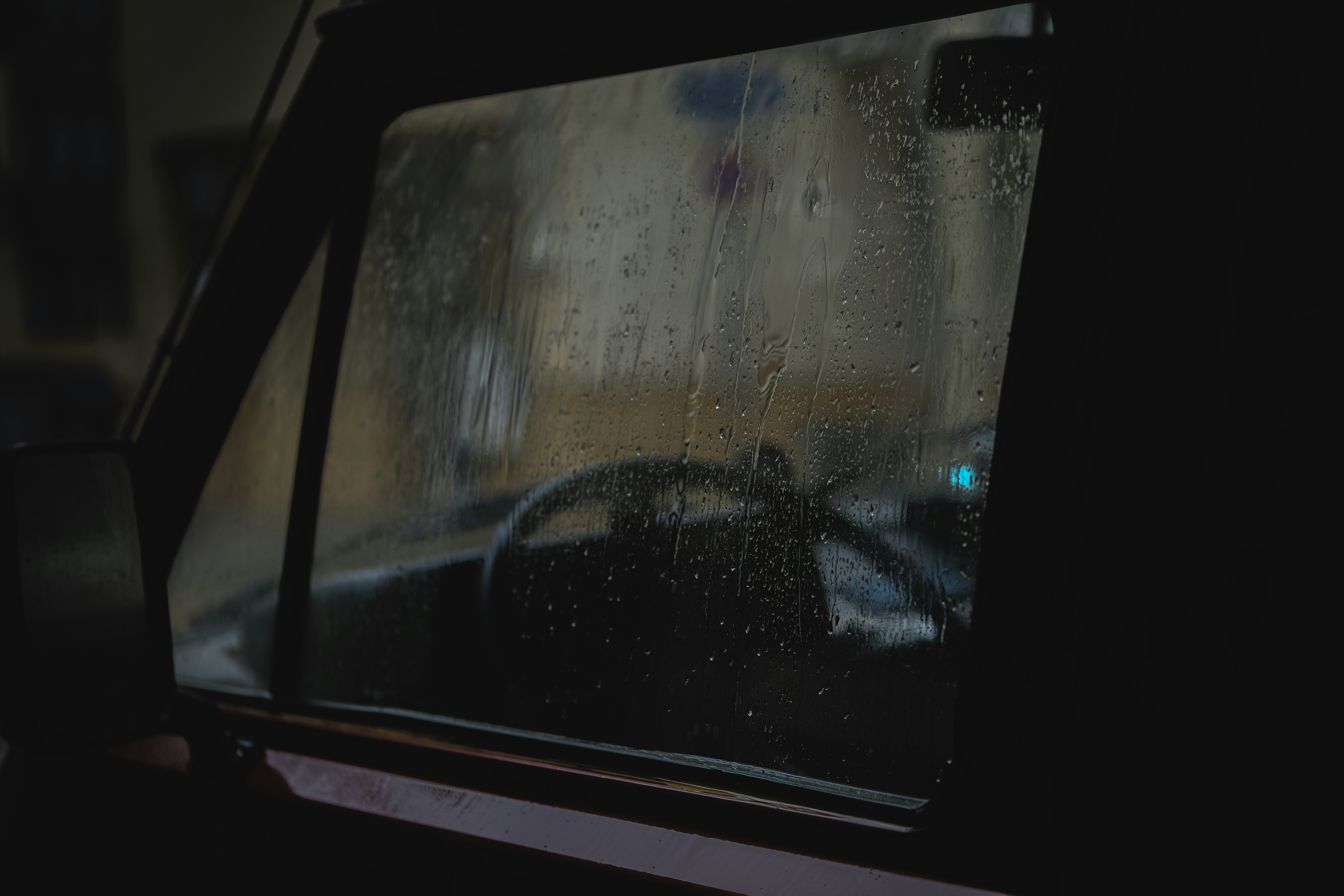 a car window with rain drops on it