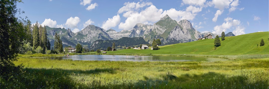 landscape photography of green mountain, The Alpstein mountain range as seen from the Schwendisee. We are looking at the Alpstein from the Toggenburg side.