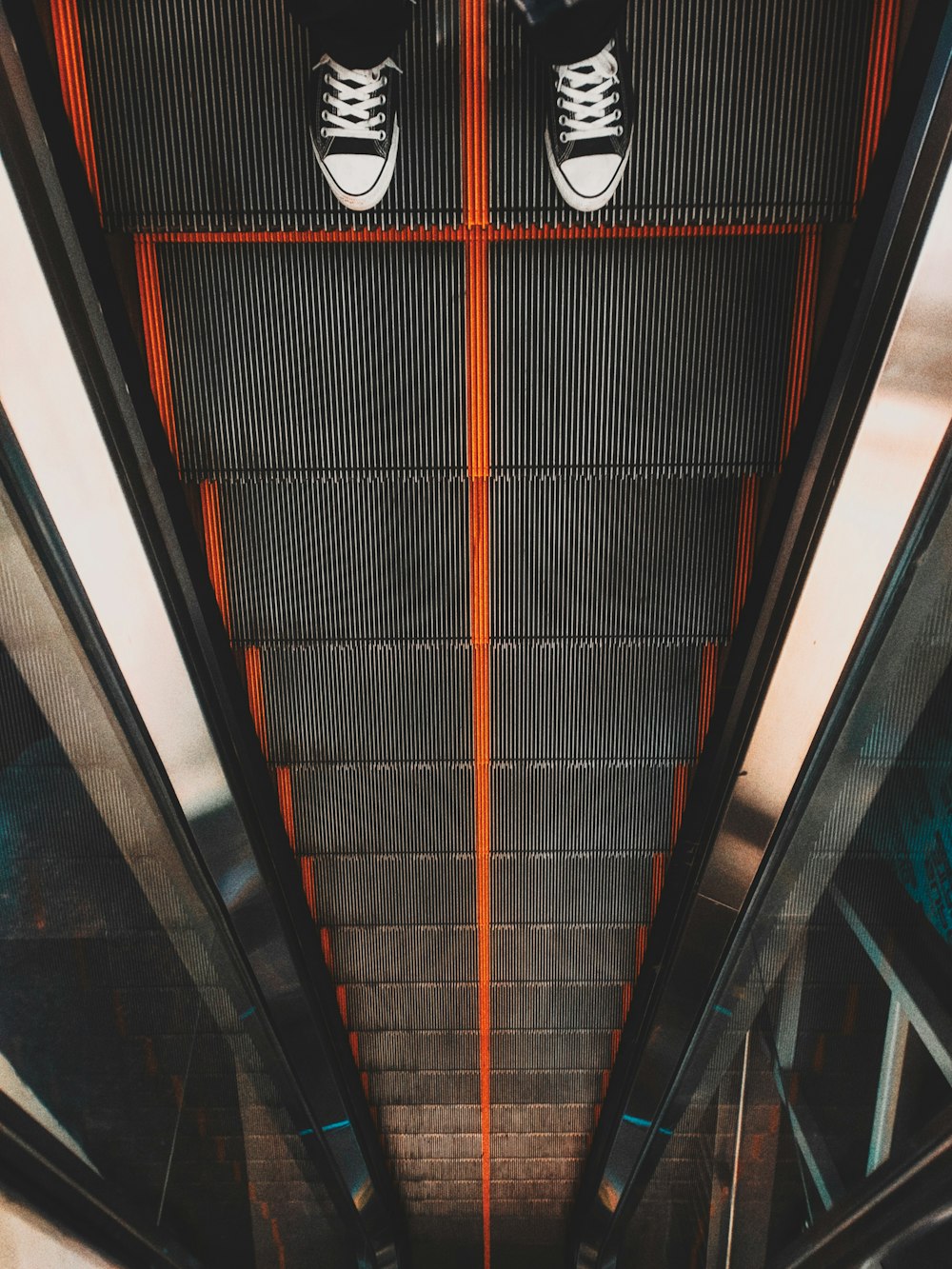 person on escalator