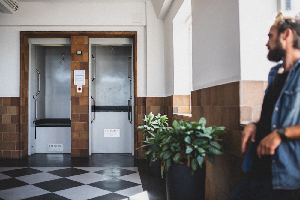 man standing near door