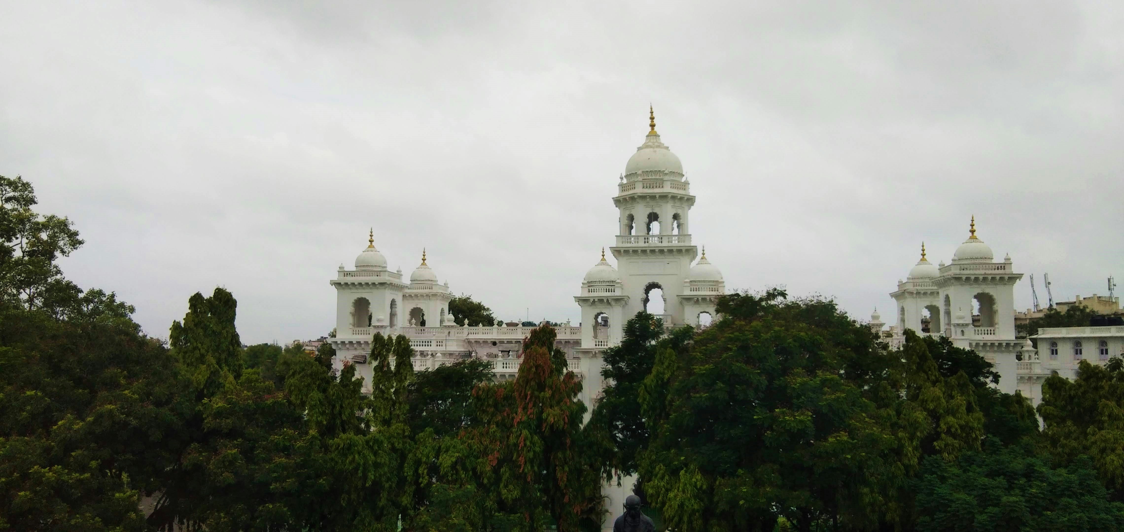 temple behind green trees