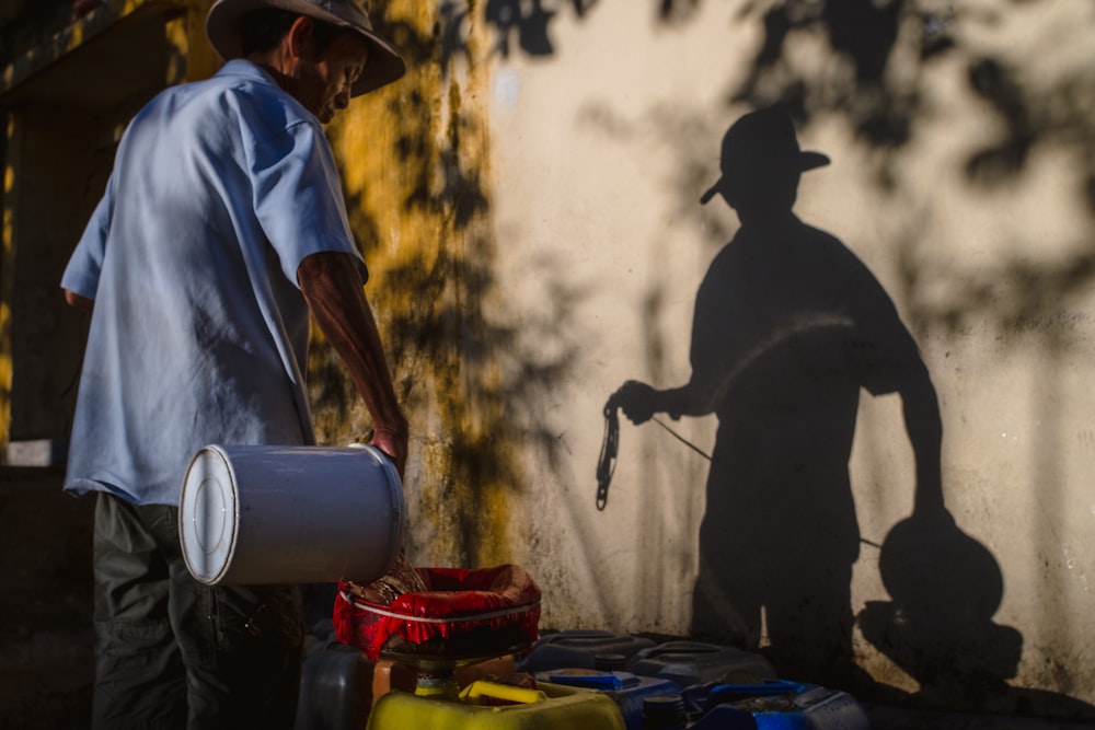 man holding bucket