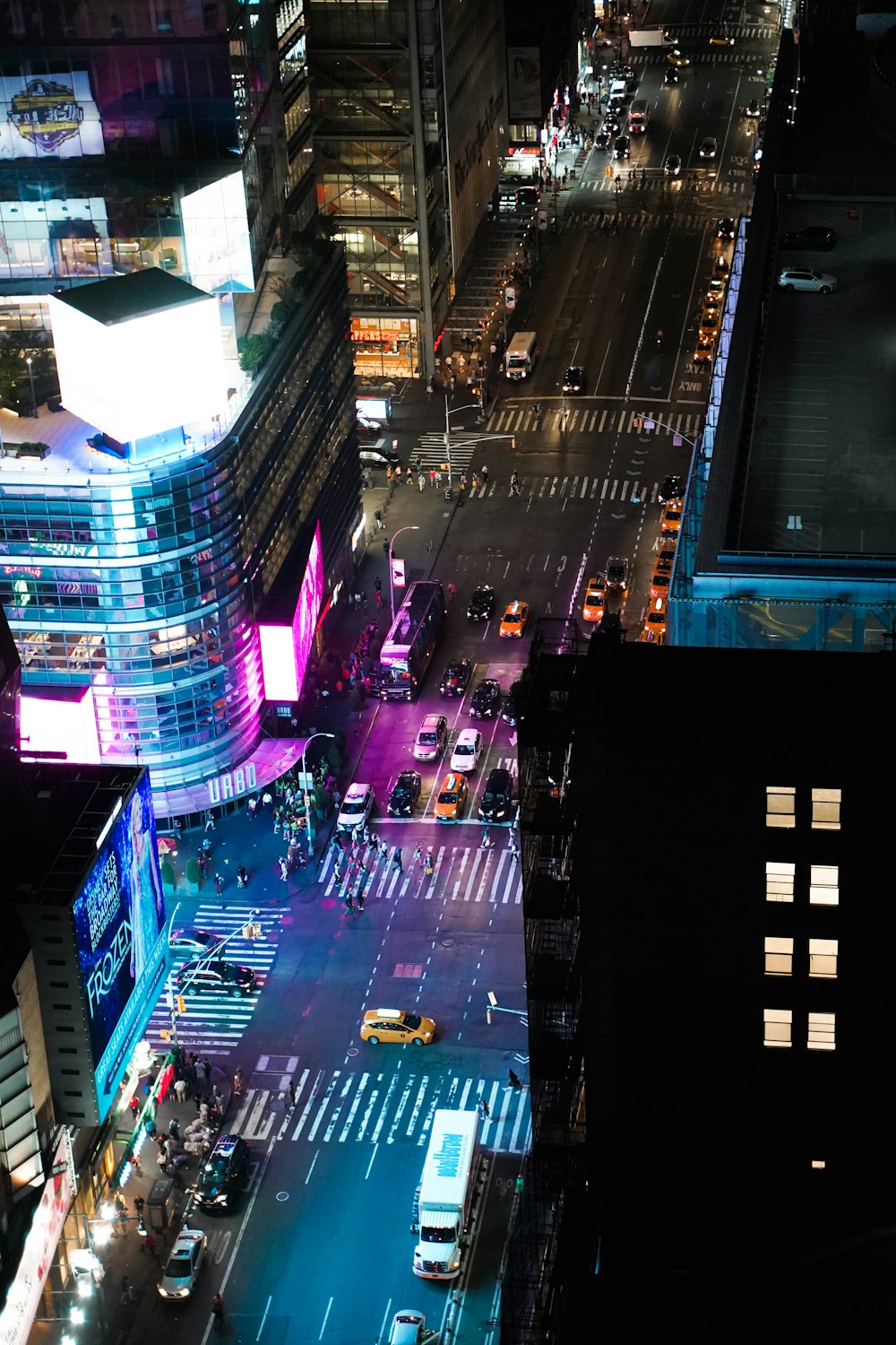 vehicles and buildings at night