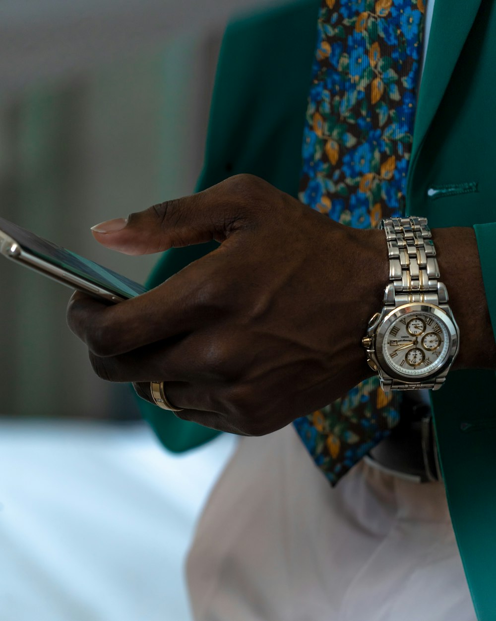 a close up of a person holding a cell phone