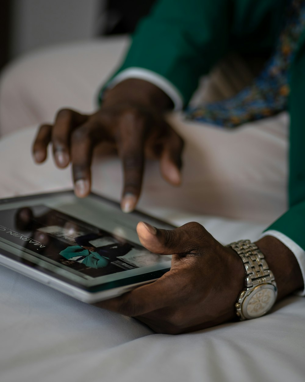 person holding a tablet close-up photography