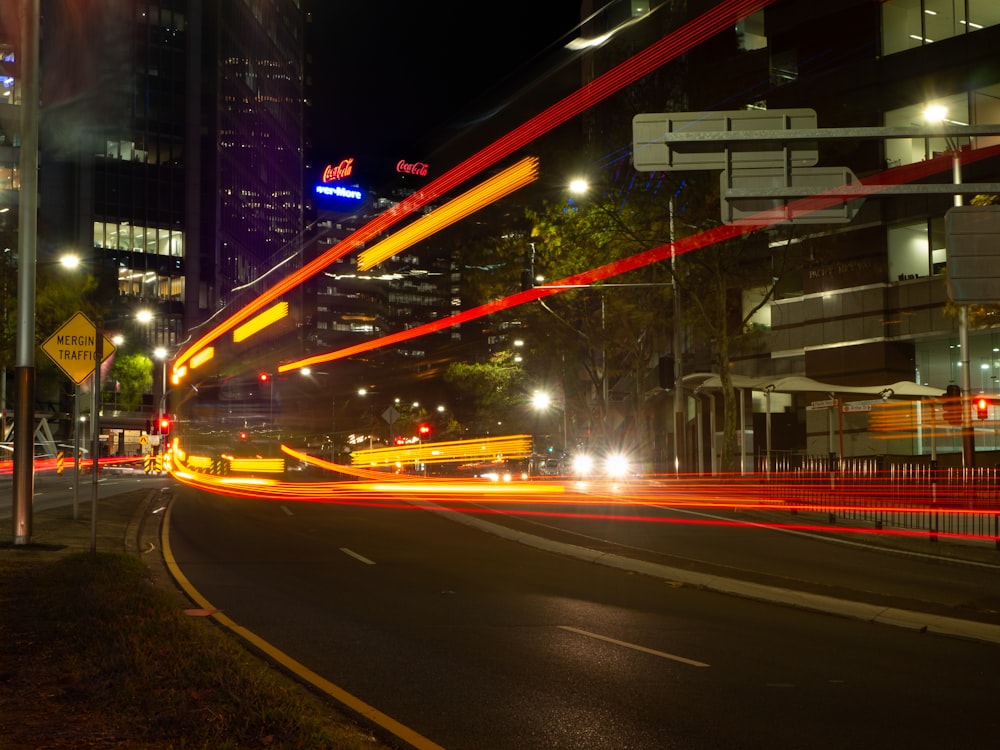 time-lapse photography of vehicles on road at night