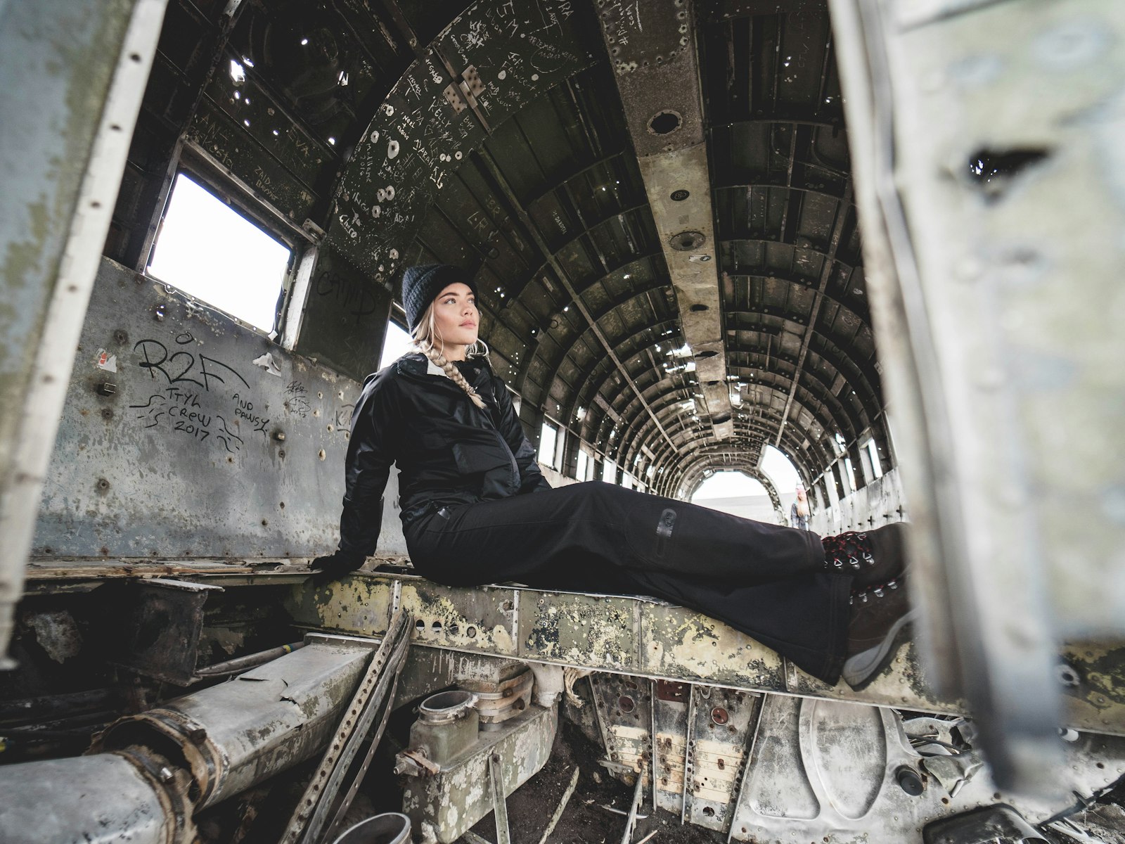 Sony a7 III + Samyang AF 14mm F2.8 FE sample photo. Woman sitting inside wrecked photography