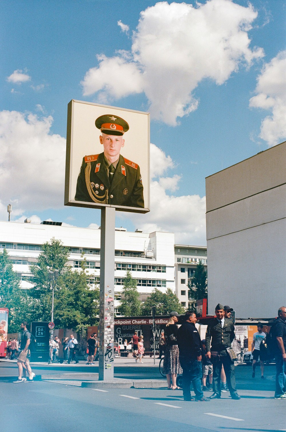 men standing under a billboard