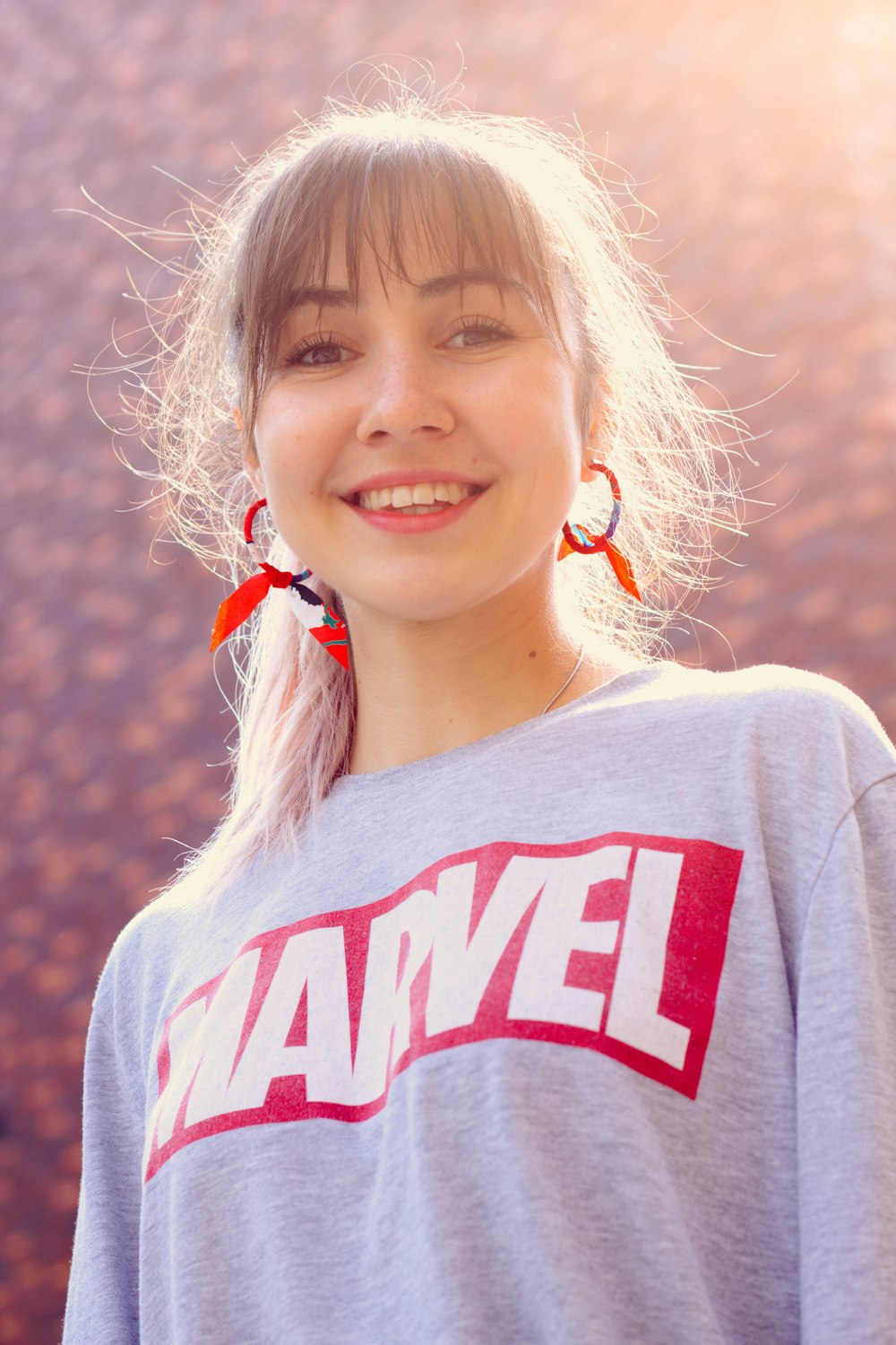 woman wearing gray and red Marvel shirt