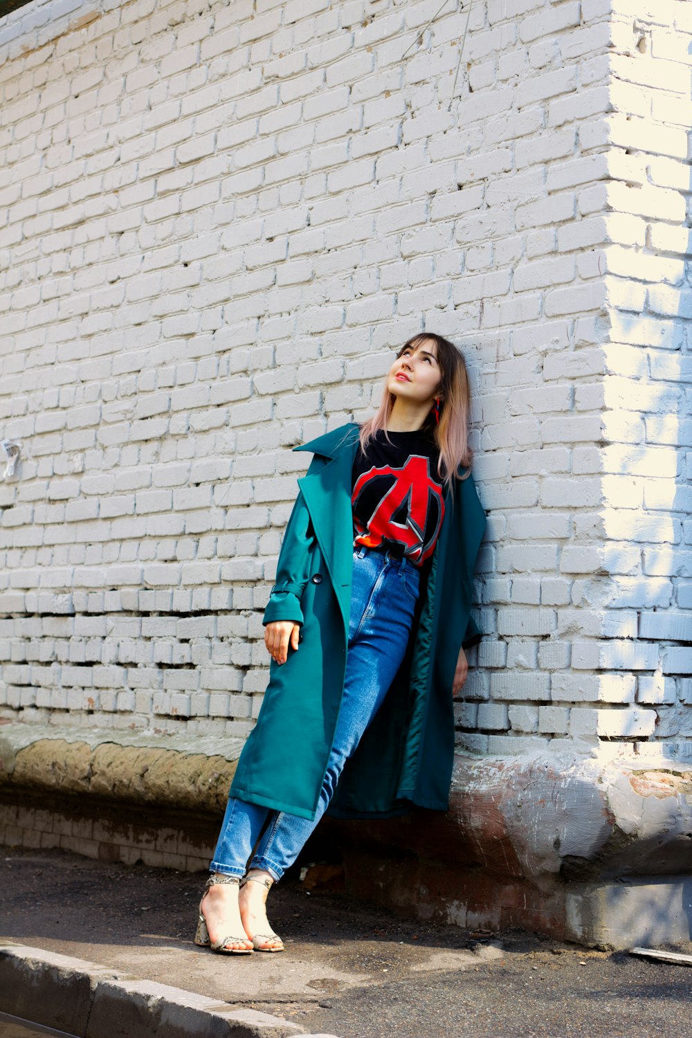 woman leaning on wall