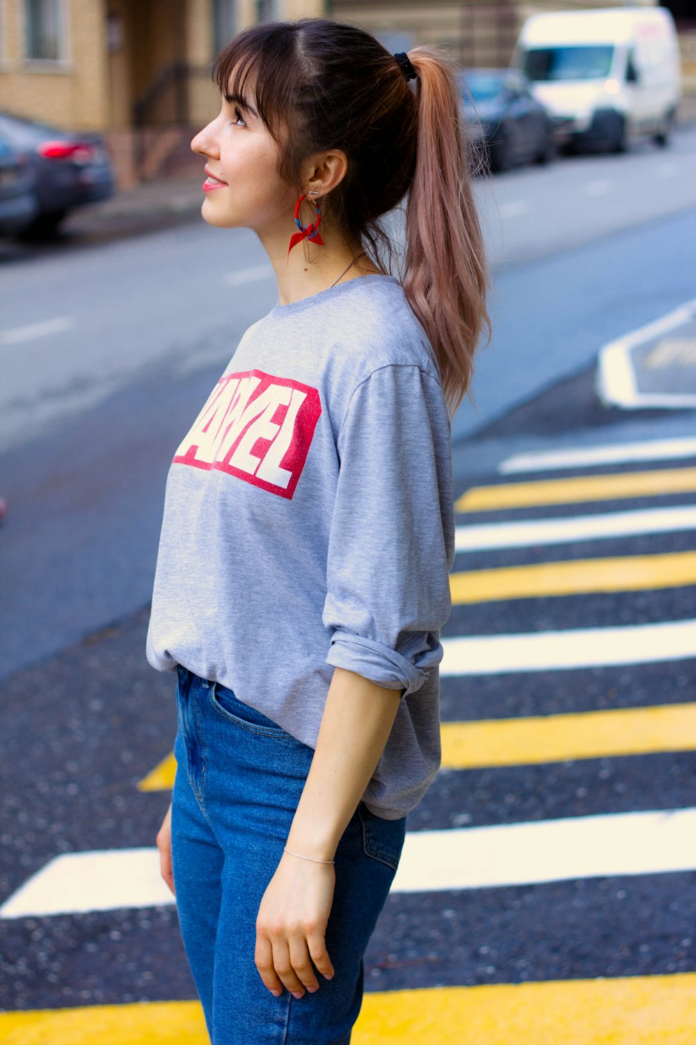 woman standing on pedestrian lane