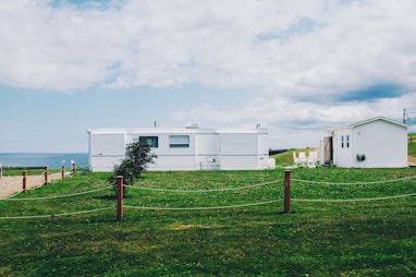 white shed near sea