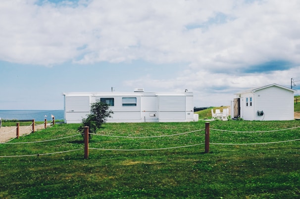 white shed near sea