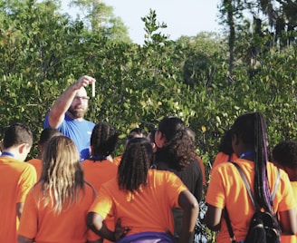 man standing in front of women