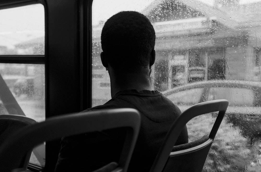 man looking at window