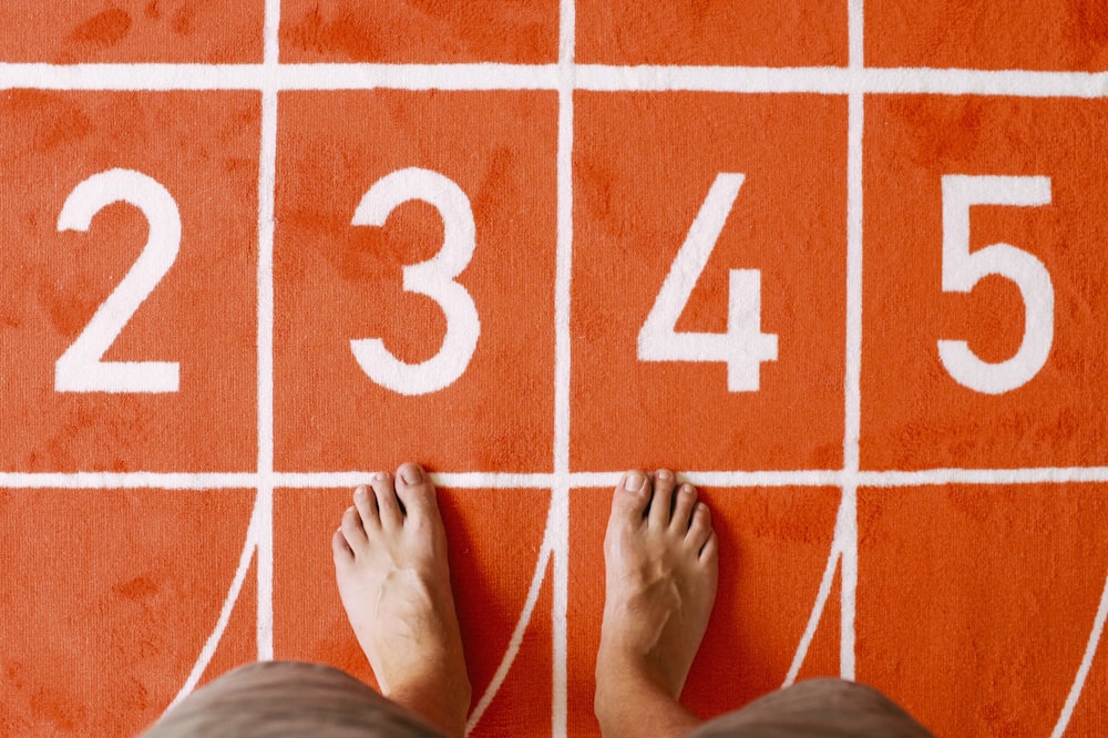 person standing on orange floor