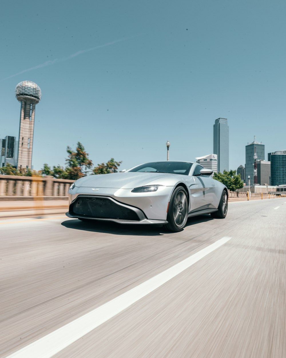 silver coupe on road