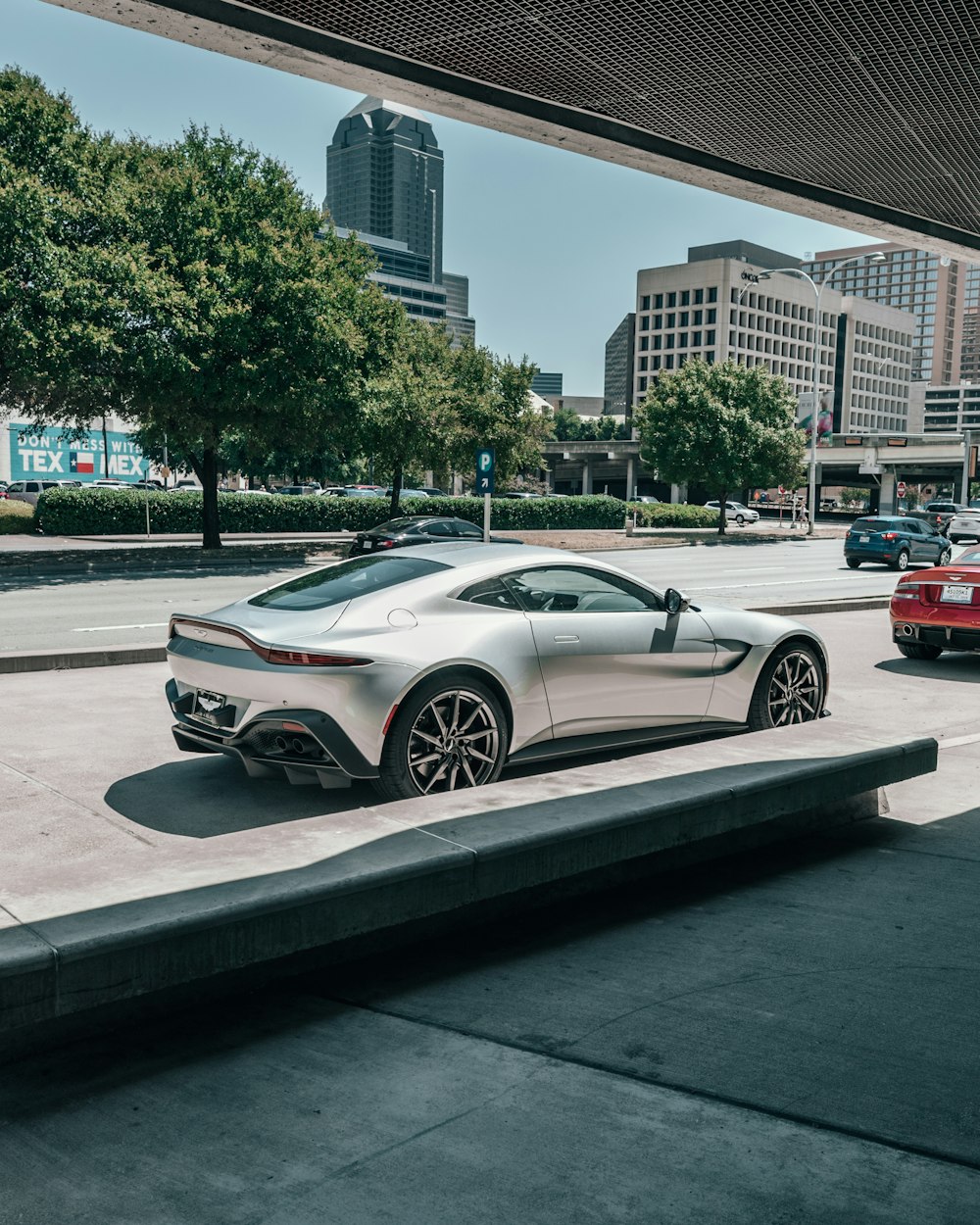 gray coupe on road