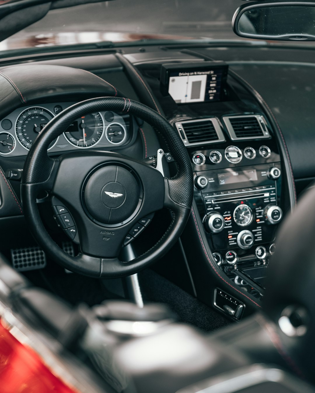 black Aston Martin steering wheel
