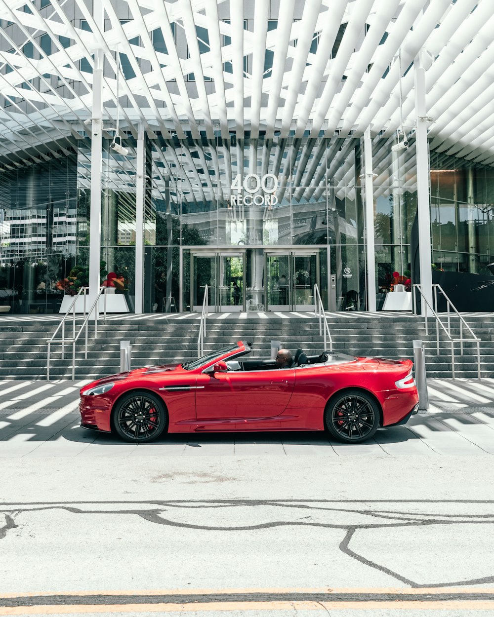 red convertible parked on street