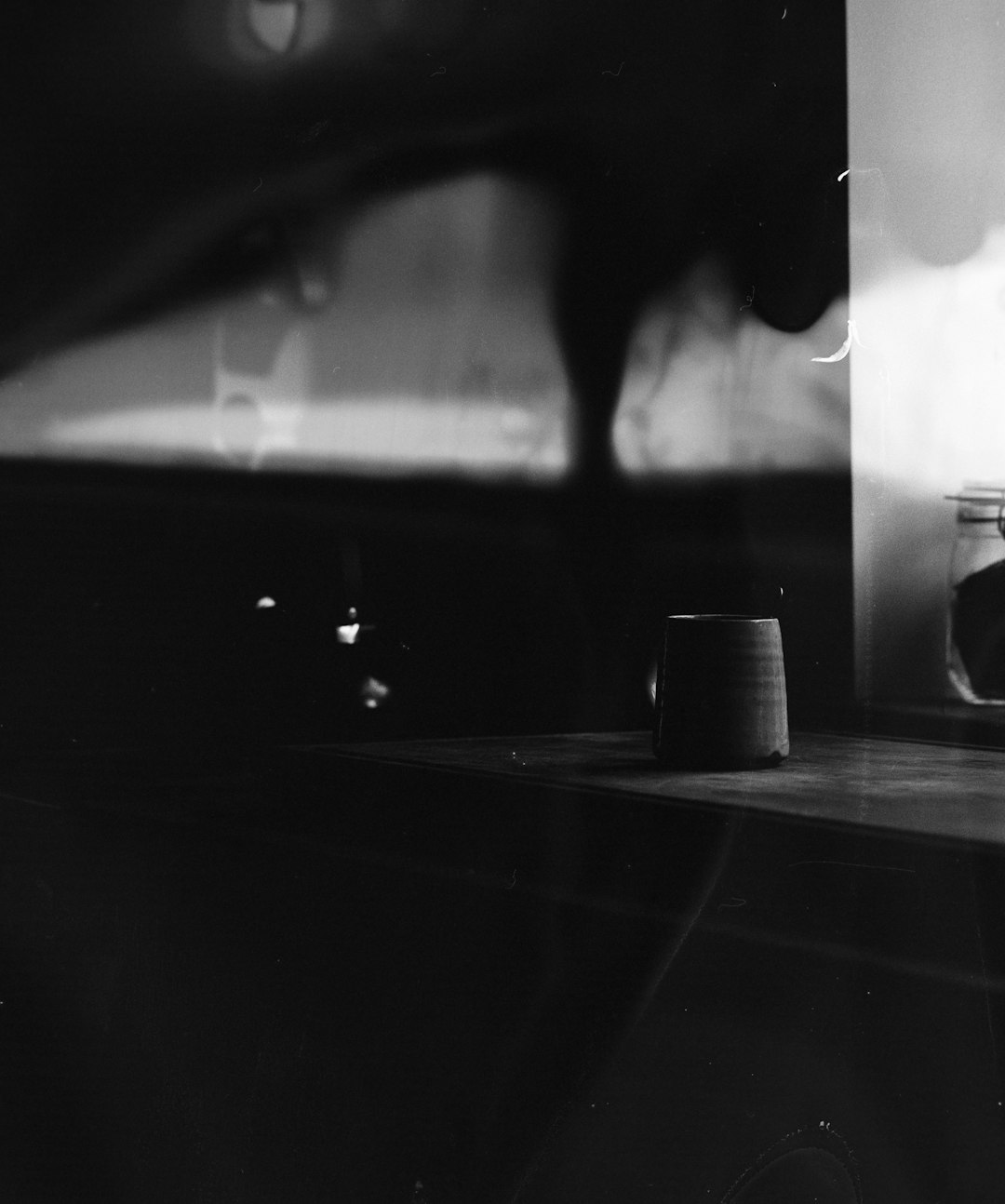 grayscale photo of cup