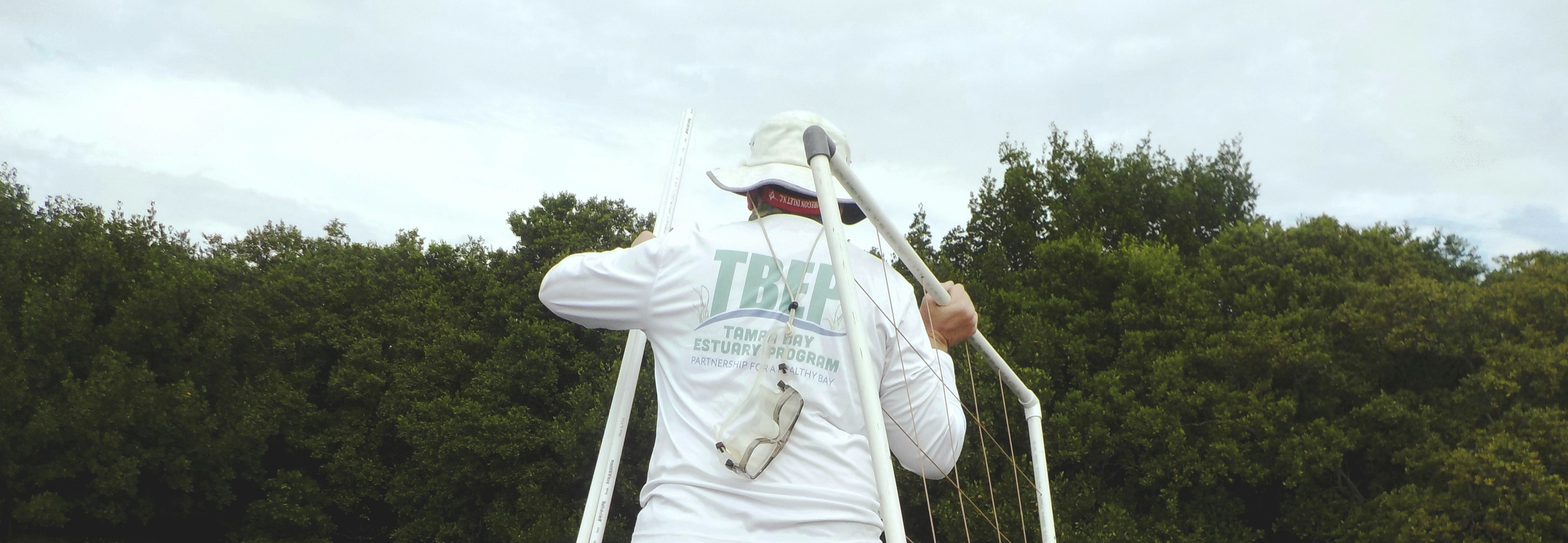 man in white long-sleeved shirt and bucket hat