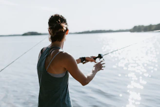 woman holding fishing rod