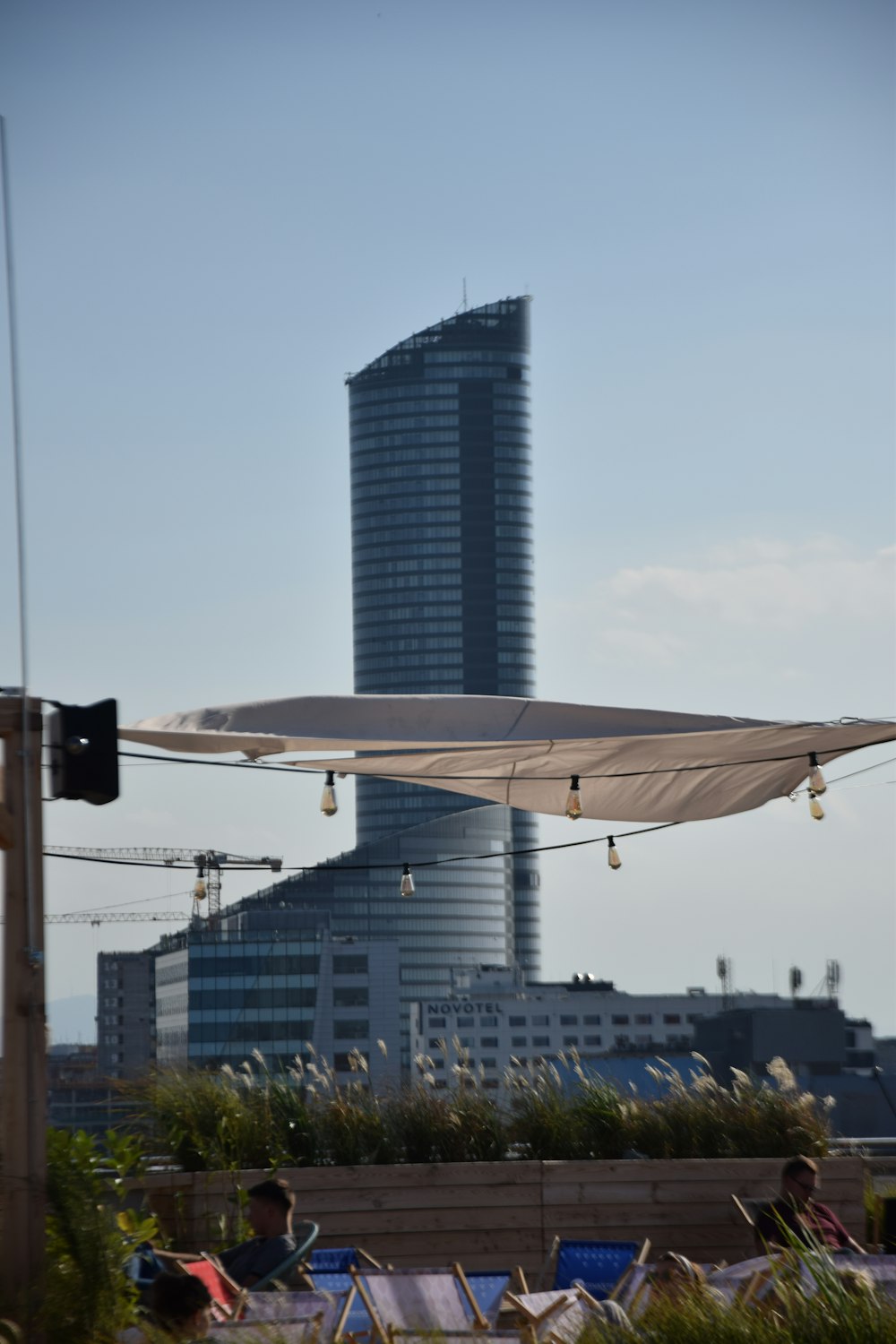 white canopy across gray tower building during daytime