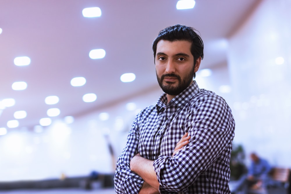 man wearing black and white checkered sport shirt