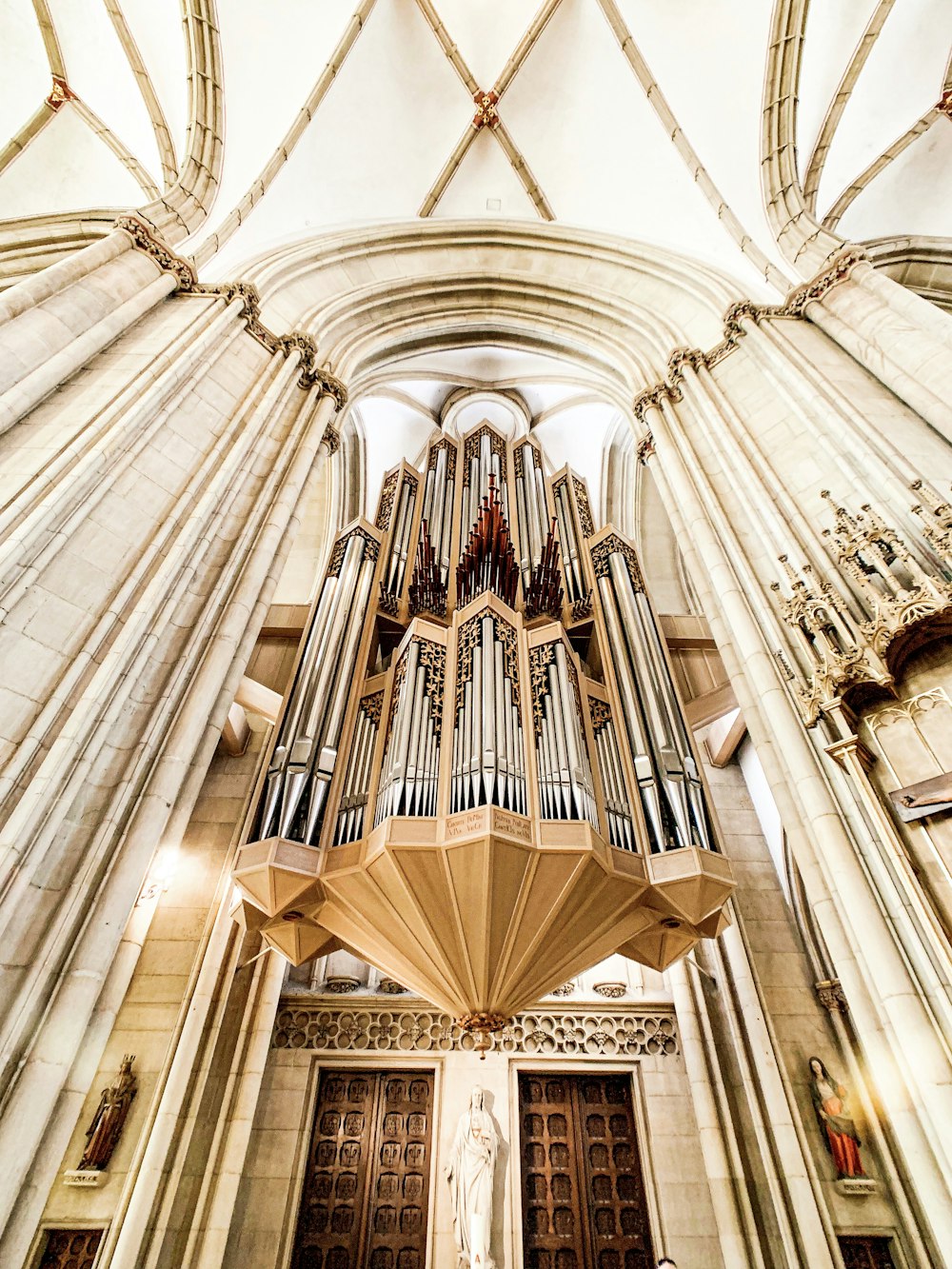 a cathedral with a pipe organ hanging from the ceiling