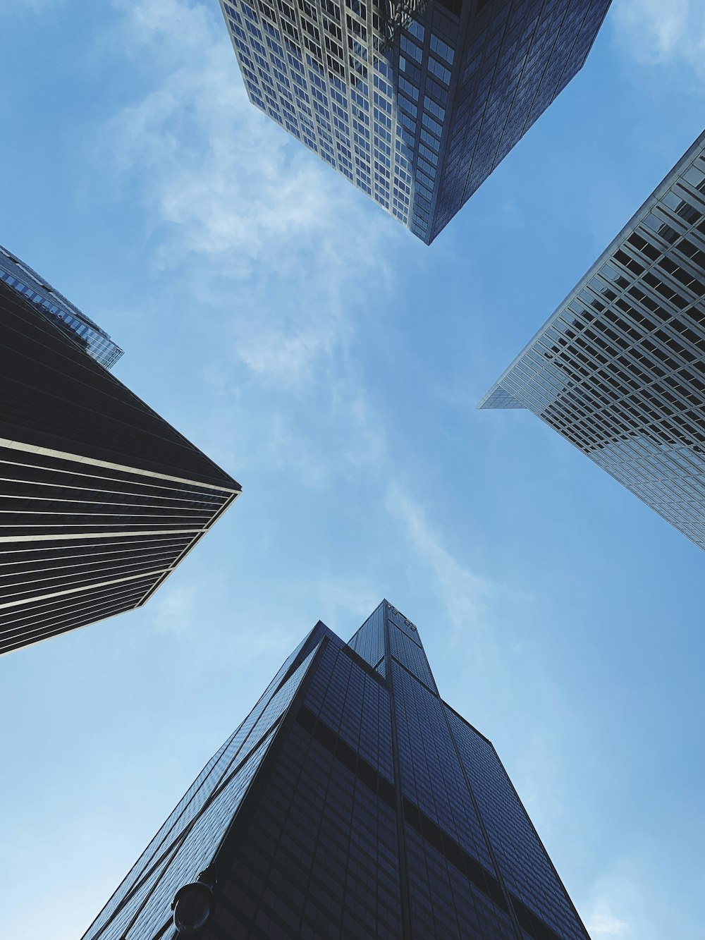 looking up at skyscrapers in a city