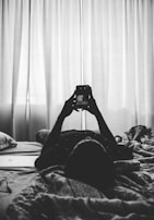 A user browsing apk paradise on a phone in a cozy home setting with natural light.