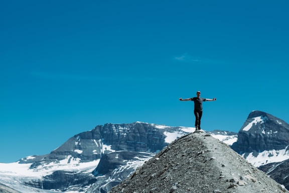 person standing on mountain