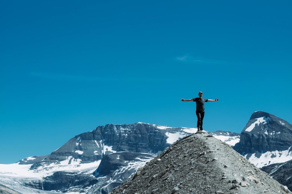 person standing on mountain