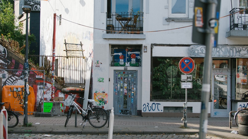 bikes parked beside the road in front of building