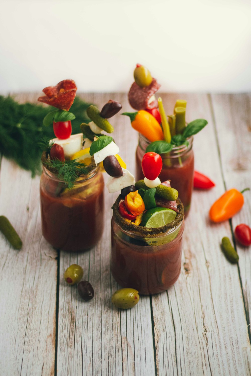 three jars of vegetables and liquid