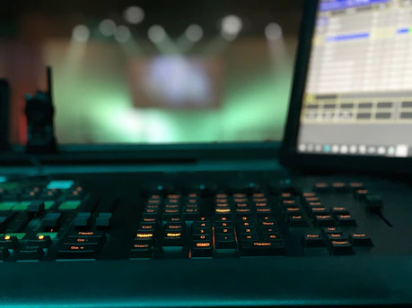 a close-up of a sleek, high-tech security panel glowing softly in a dimly lit control room