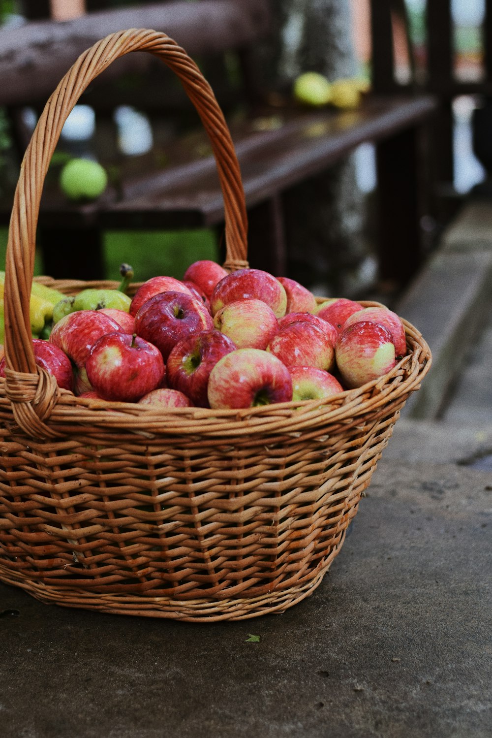 red apple fruits on basket