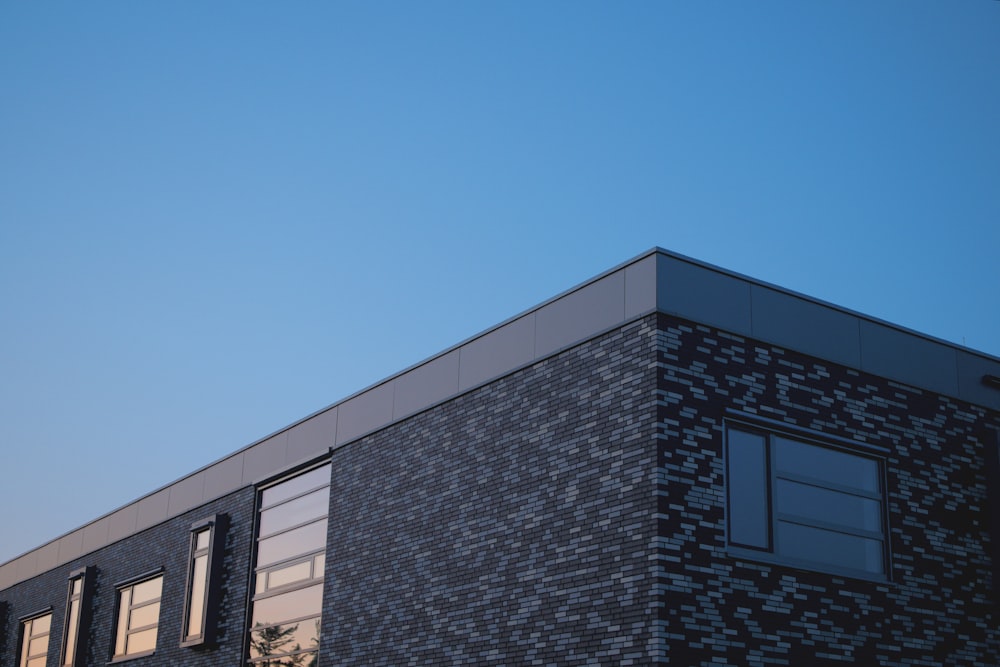 gray concrete building under clear blue sky