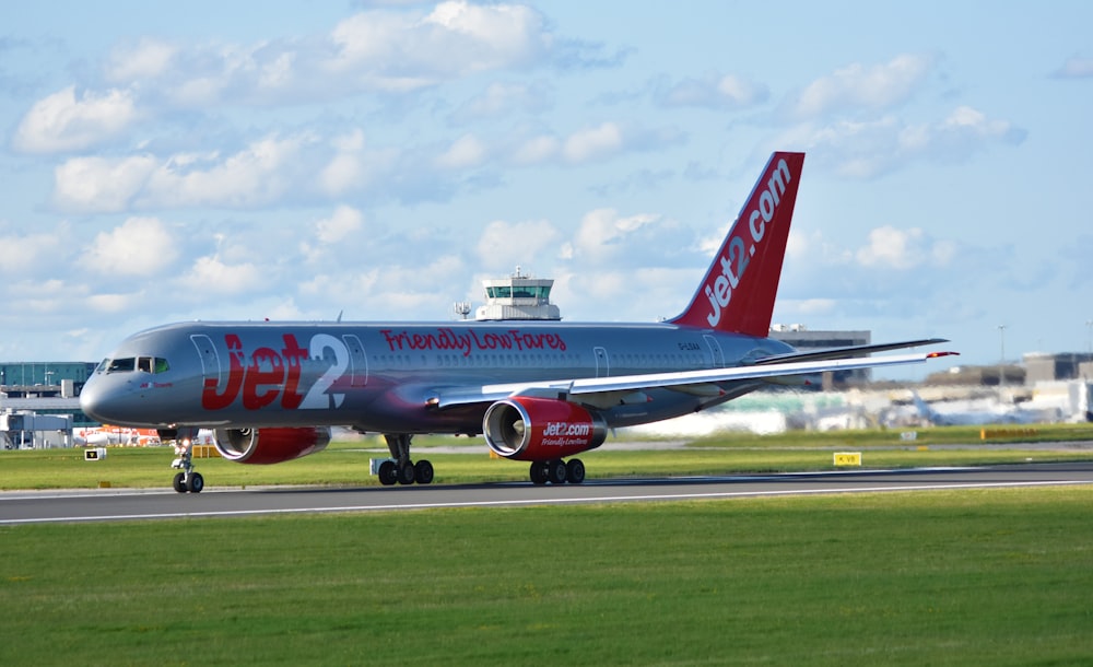 grey and red Jet 2 airplane