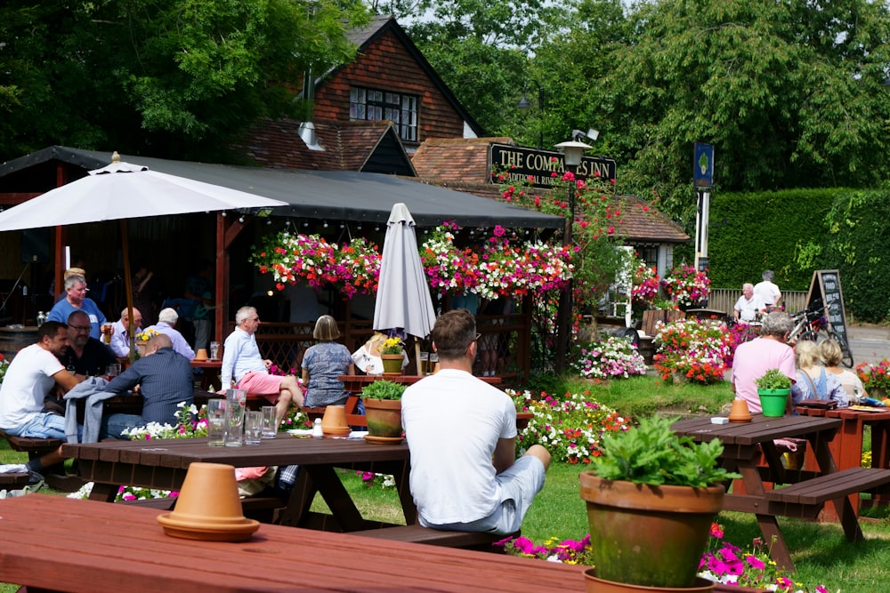 person sitting on picnic table at daytime