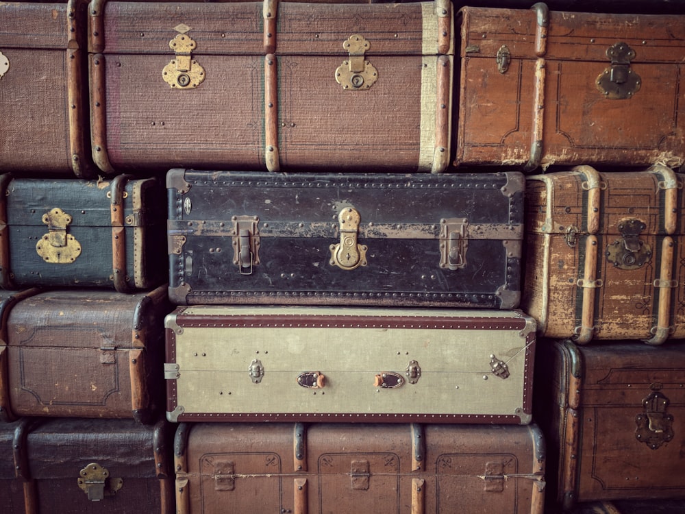 pile of brown suitcase lot