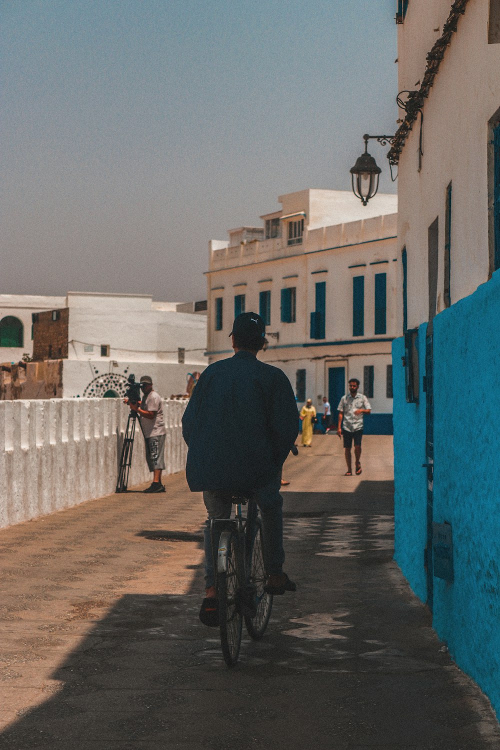 people on street beside buildings