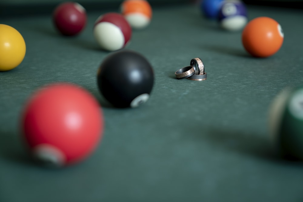 gold rings surrounded with billiard balls
